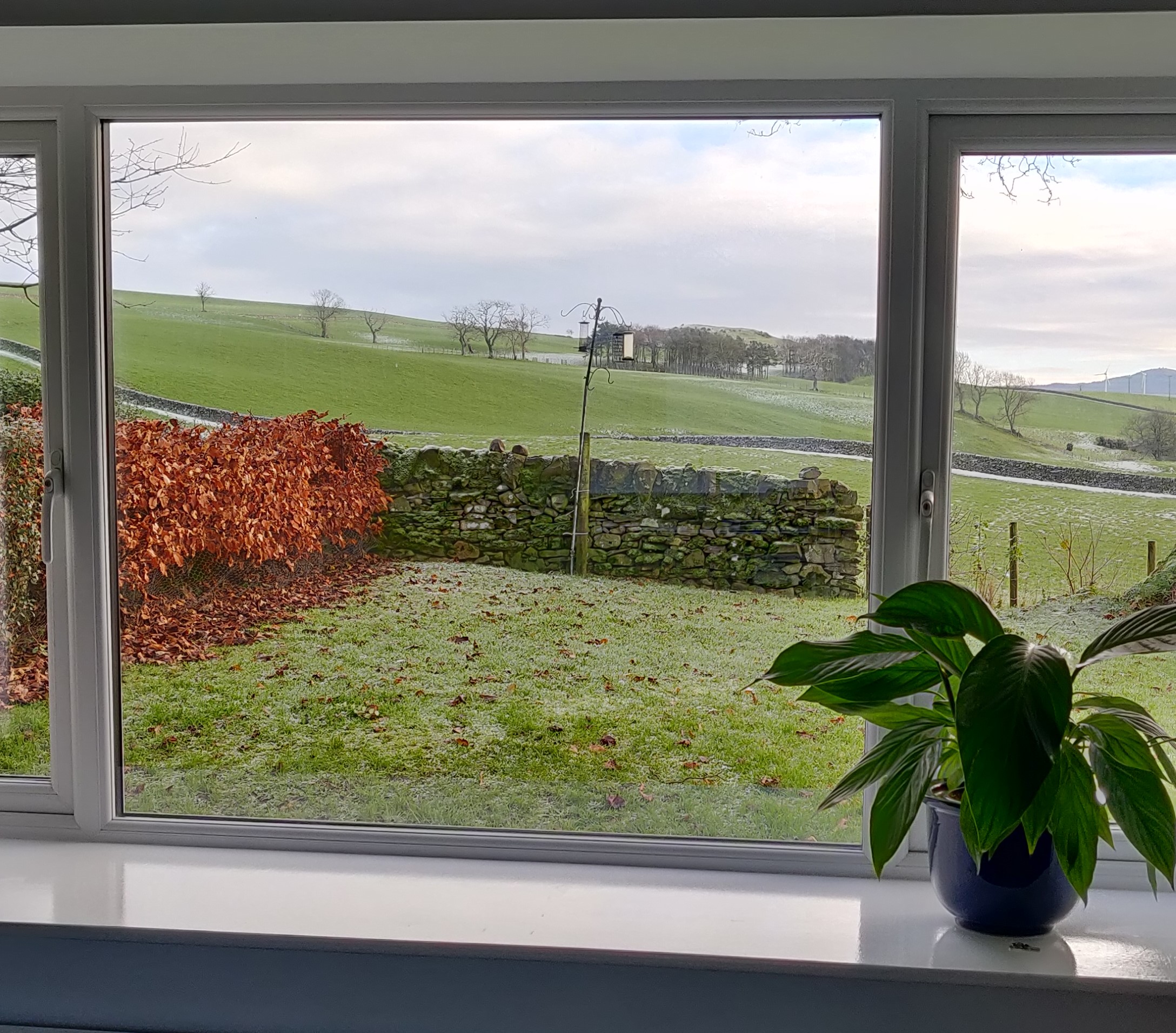 View from kitchen lounge window over countryside.
