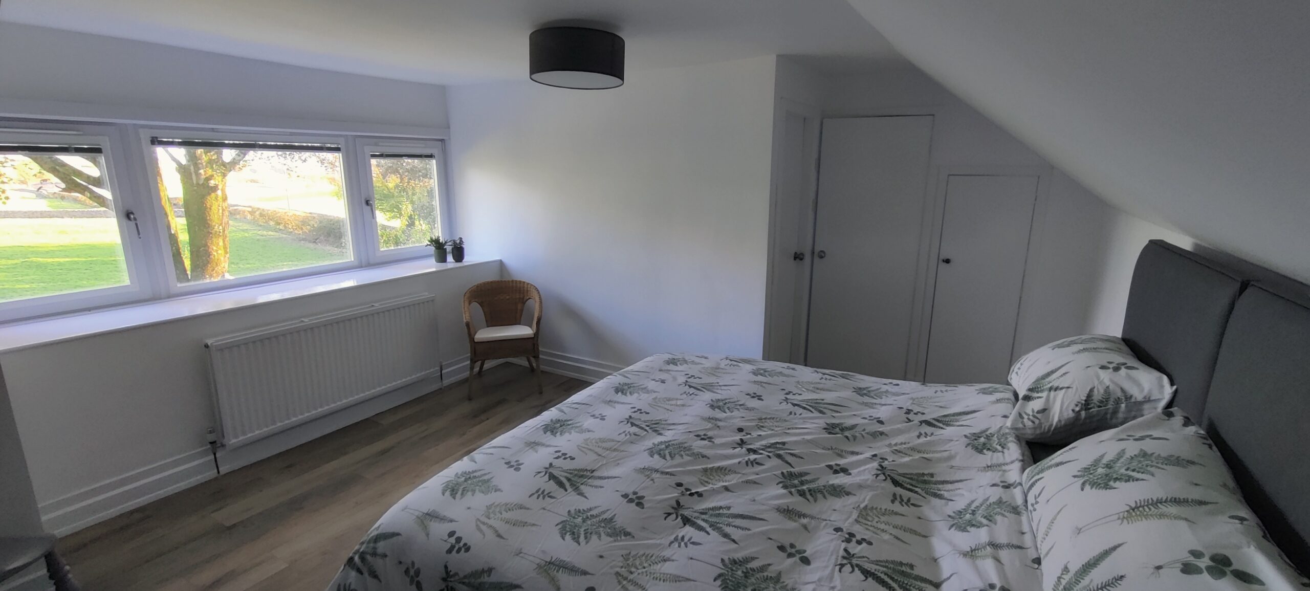 Bedroom showing super kingsize bed.