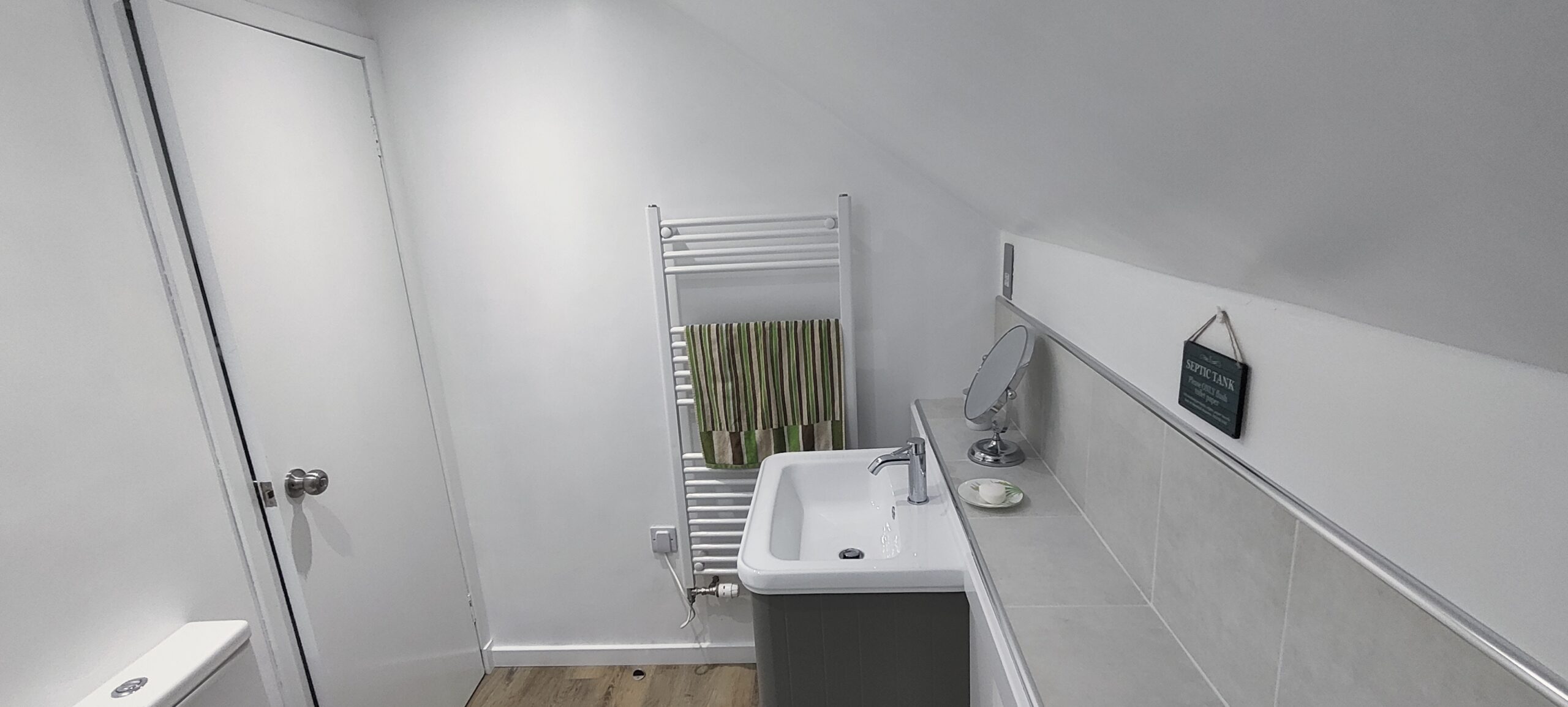 Shower room showing sink and radiator